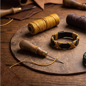Dark brown and gold bracelet on a wooden surface with text about craftsmanship and style.Handmade leather bracelet with jute weave on a beach setting, featuring text about product features. footy,HAWTHORN HAWKS,football,club,AFL,
#AFL #Footy #AustralianRulesFootball #AFLBracelets #HandmadeJewelry #FootyFans
