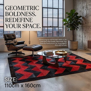 KANDM PARSE LEATHER SHOP geometric chevron patchwork hide rug in black and red, styled in a modern living room.