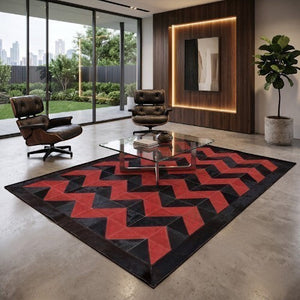 KANDM PARSE LEATHER SHOP geometric chevron patchwork hide rug in black and red in a modern living room setting.
