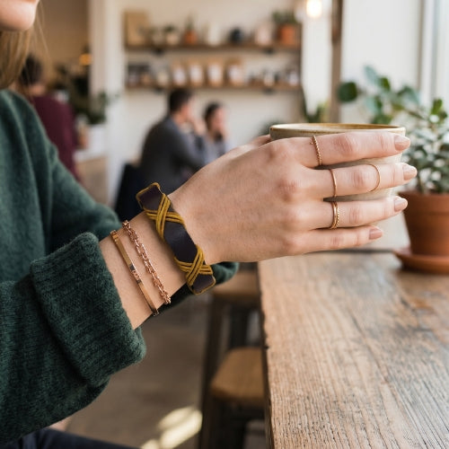 Dark brown and gold bracelet on a wooden surface with text about craftsmanship and style.Handmade leather bracelet with jute weave on a beach setting, featuring text about product features. footy,HAWTHORN HAWKS,football,club,AFL,
#AFL #Footy #AustralianRulesFootball #AFLBracelets #HandmadeJewelry #FootyFans
