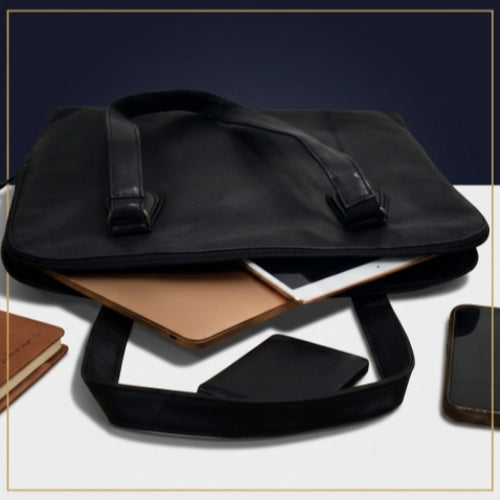 Black leather laptop tote bag securely holding a 14-inch laptop and documents