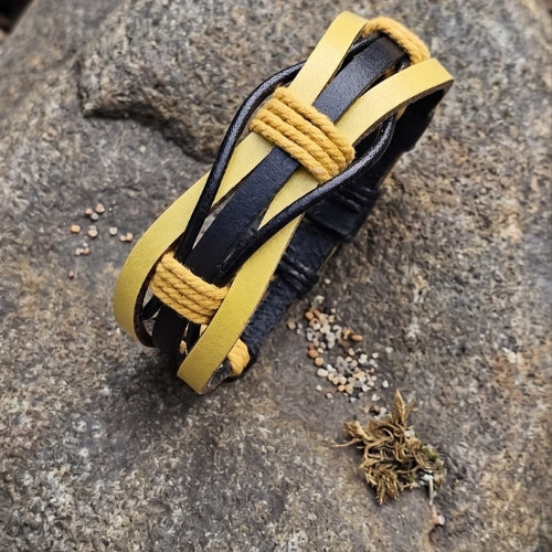 Collage of a handmade yellow and black braided leather bracelet. Shows the sporty wristband with yellow waxed cord details, adjustable black snap closures, and the bracelet laid flat