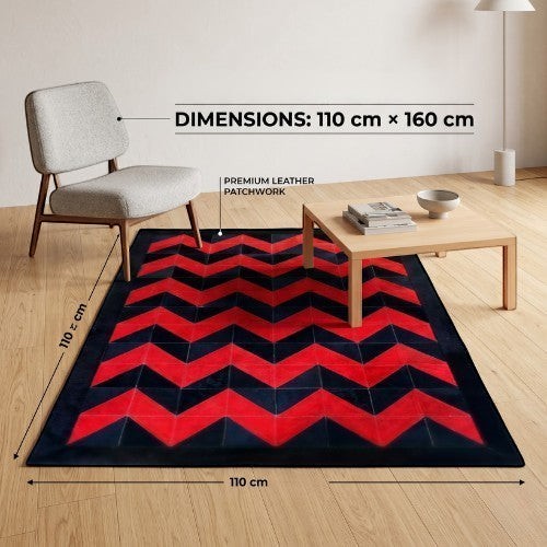 KANDM PARSE LEATHER SHOP geometric chevron patchwork hide rug in black and red, 110x160 cm, in a modern living room.