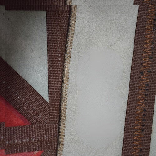 KANDM PARSE LEATHER SHOP handcrafted patchwork rug featuring genuine cowhide and red suede with detailed stitching.